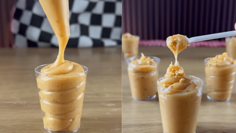 Paçoca cremosa no copinho com textura macia, finalizada com paçoca esfarelada e servida como doce de festa junina.
